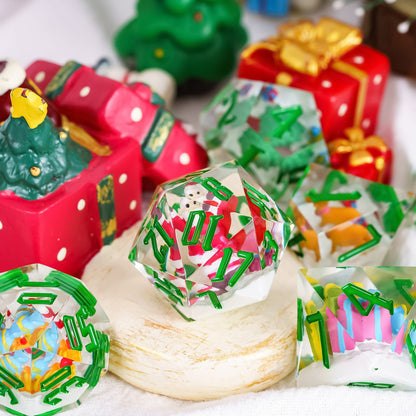 Close detail of Santa's Workshop D20 with Santa figure encapsulated in clear and green resin