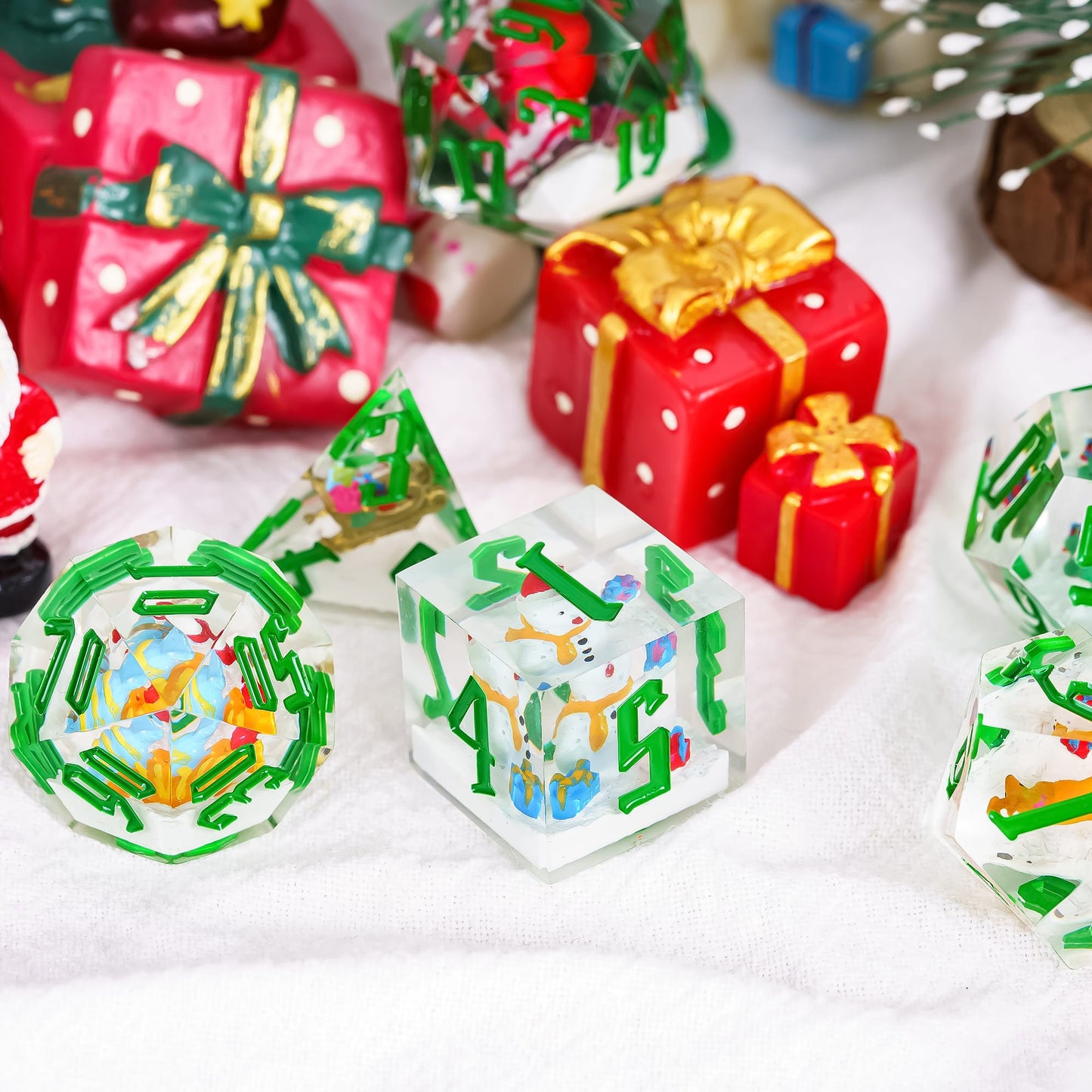 Santa’s Workshop Christmas themed dice set with mini figurines inside on holiday gift background