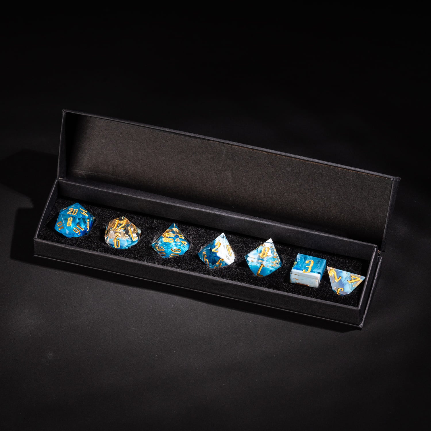 Shimmering Shoals sharp edge DnD dice set displayed in black presentation box