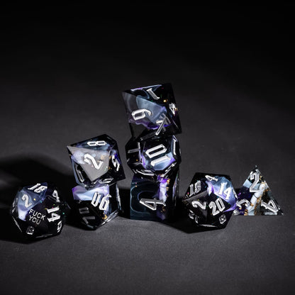 Stacked Siren's Cache Sharp Edge Dice Set with dark resin and silver numbering for DnD