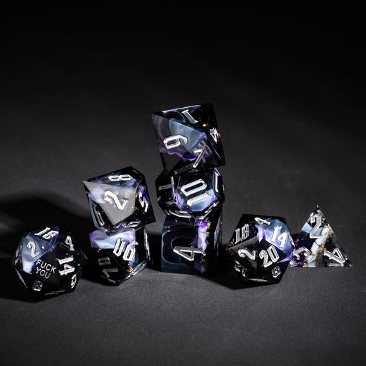 Stacked Siren's Cache Sharp Edge Dice Set with dark resin and silver numbering for DnD