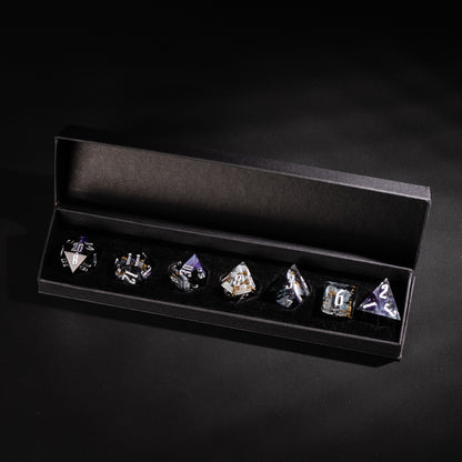 Siren’s Cache sharp edge dice set displayed in black gift box with silver numbering and gold foil flakes