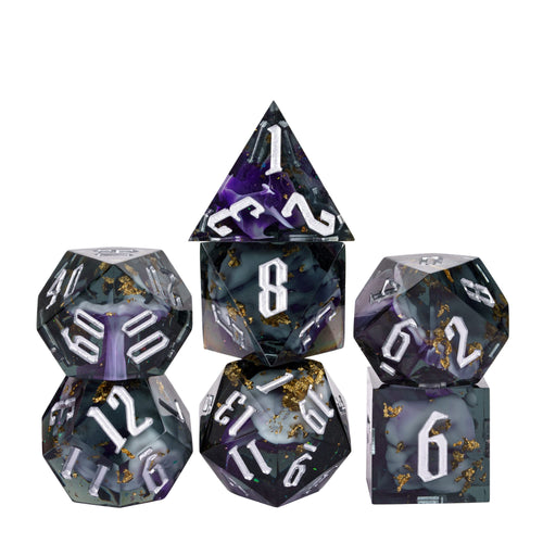 Siren’s Cache sharp edge DnD dice set with dark resin, purple swirls, gold foil, and silver numbering on white background