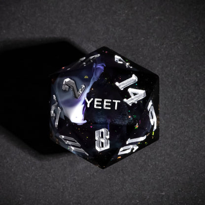 Close up of Siren's Cache Yeet D20 with dark swirling resin and silver numbers