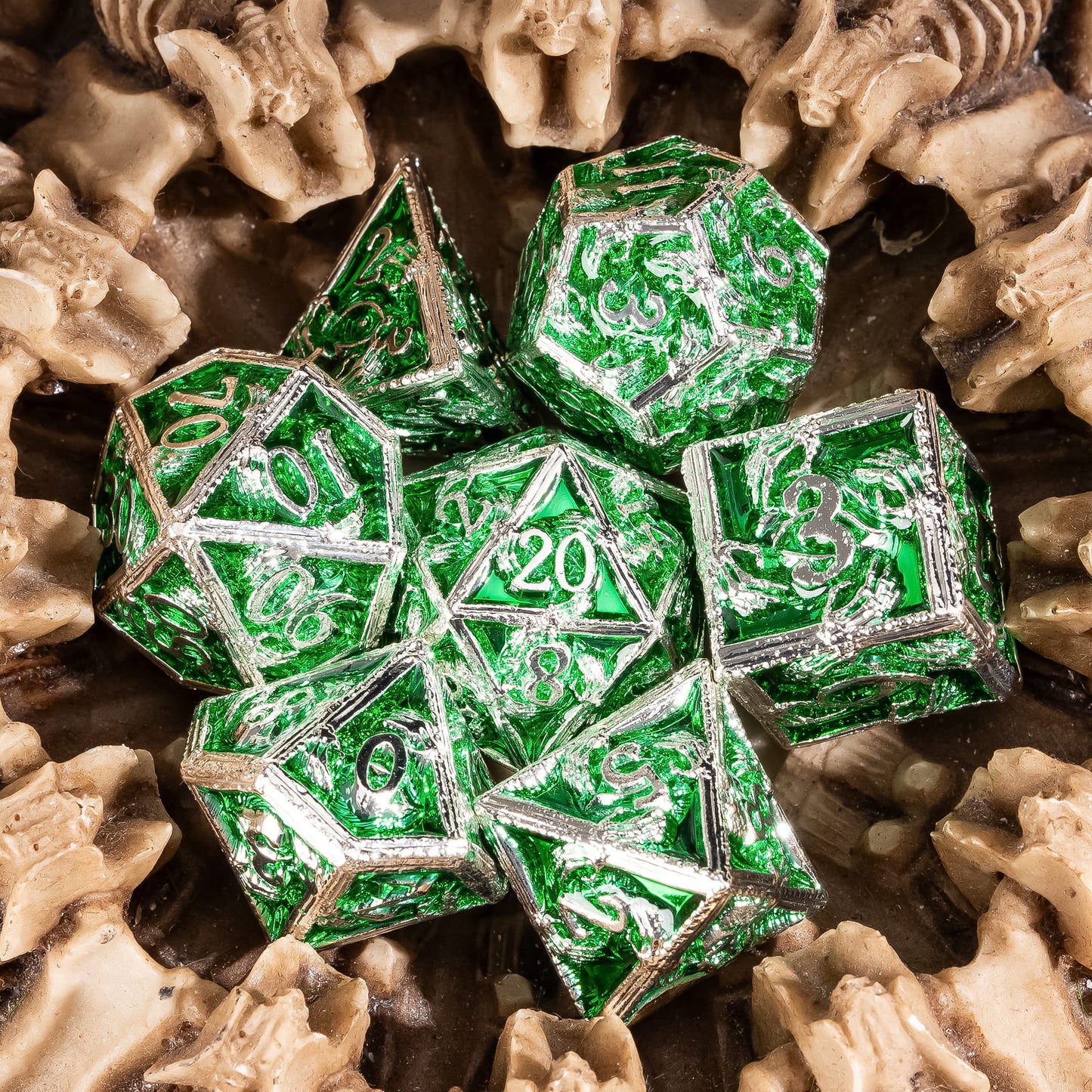 Siren's Crypt green metal DnD dice set styled on sand with skull background