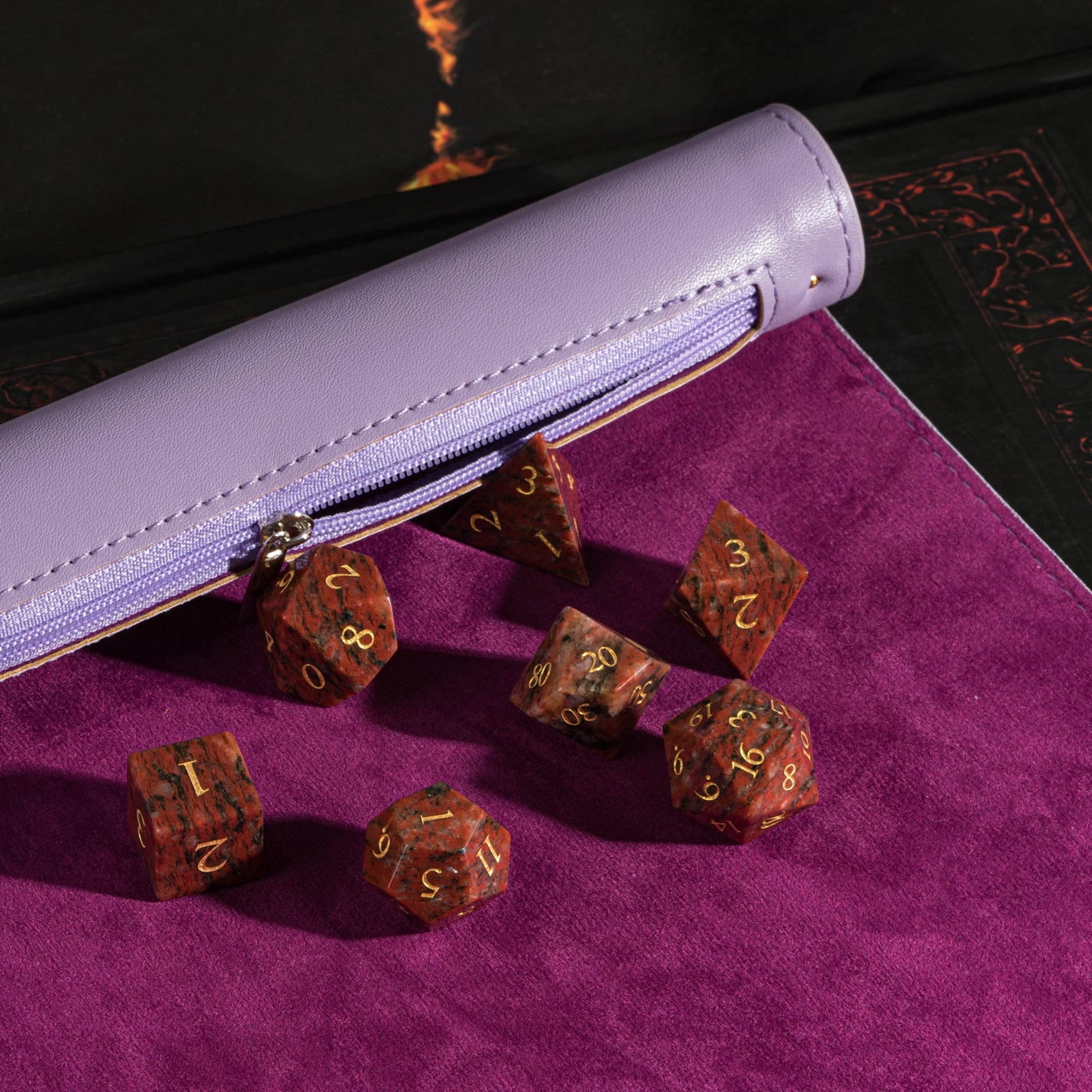 Lavender spell scroll dice tray holding red stone dice set