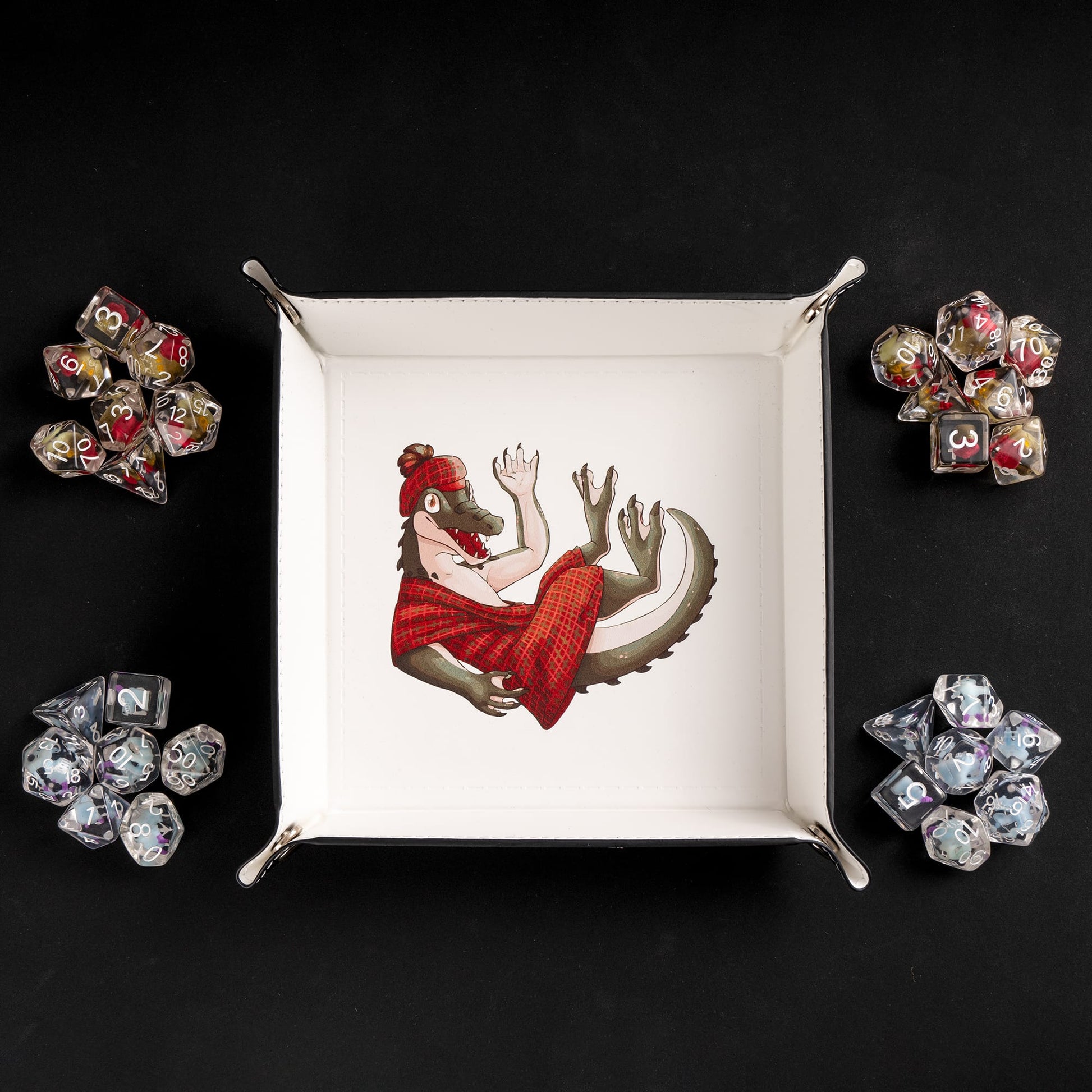 Square foldable dice tray with dice placed around gator artwork