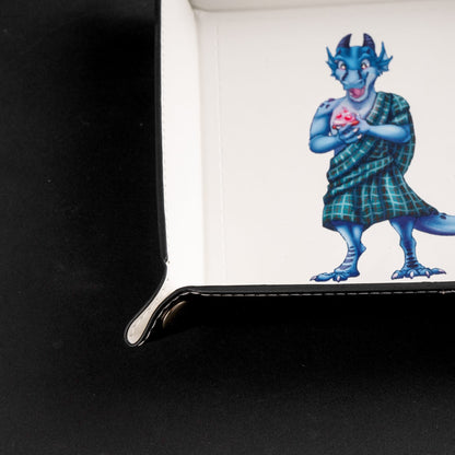 Close up of white dice tray corner and kobold print detail