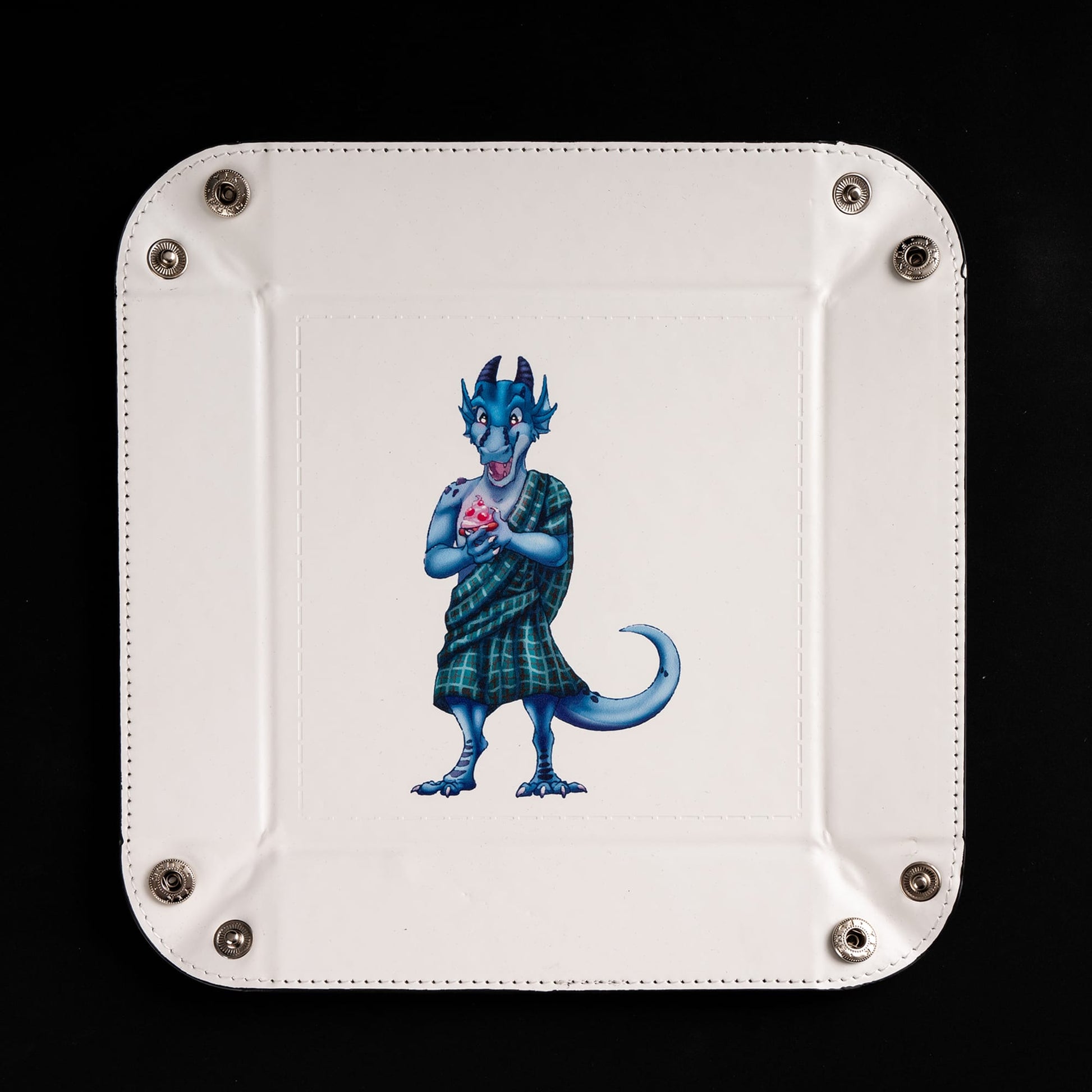 Square foldable dice tray with dice inside tray around kobold artwork