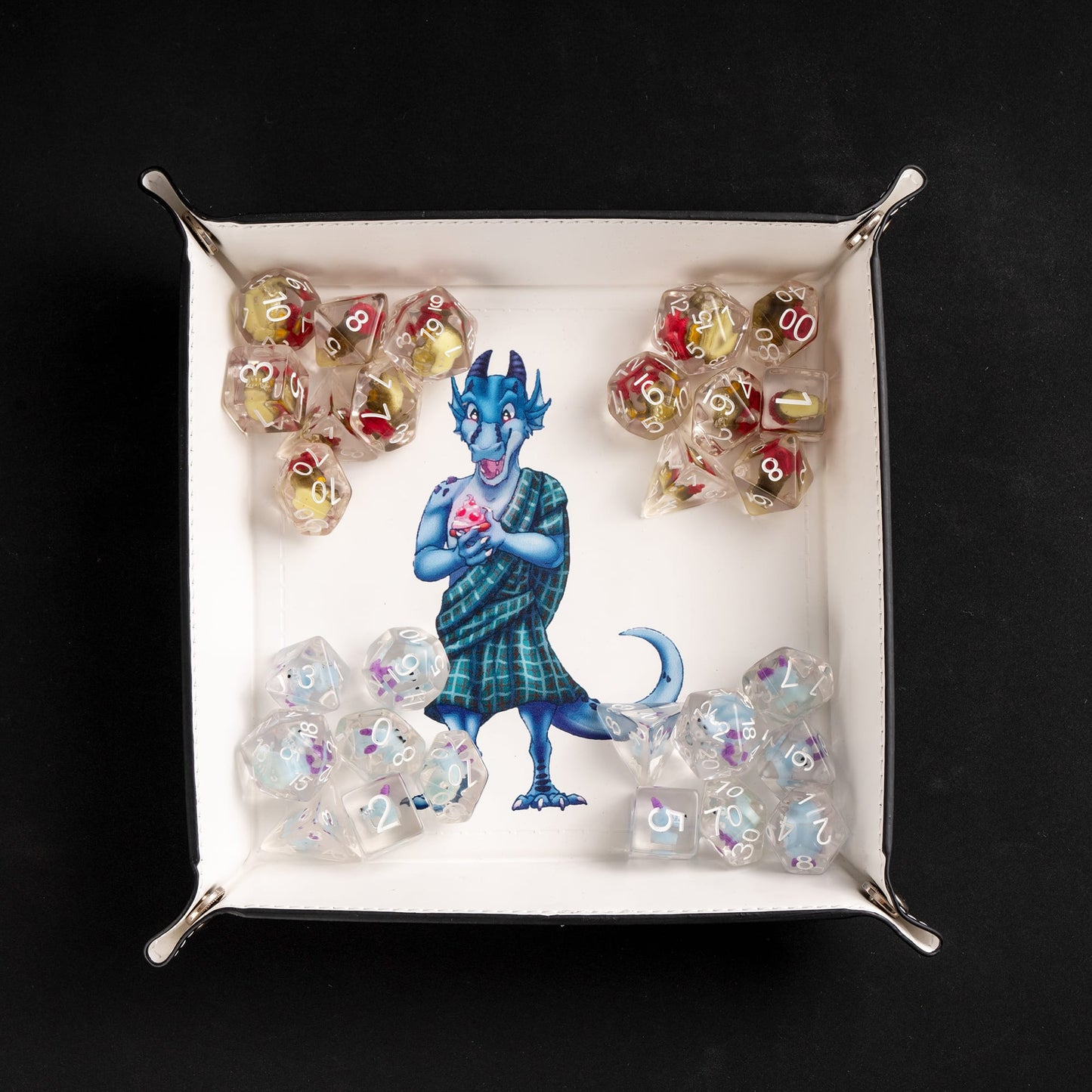Square foldable dice tray with dice inside tray around kobold artwork