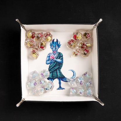 Square foldable dice tray with dice inside tray around kobold artwork