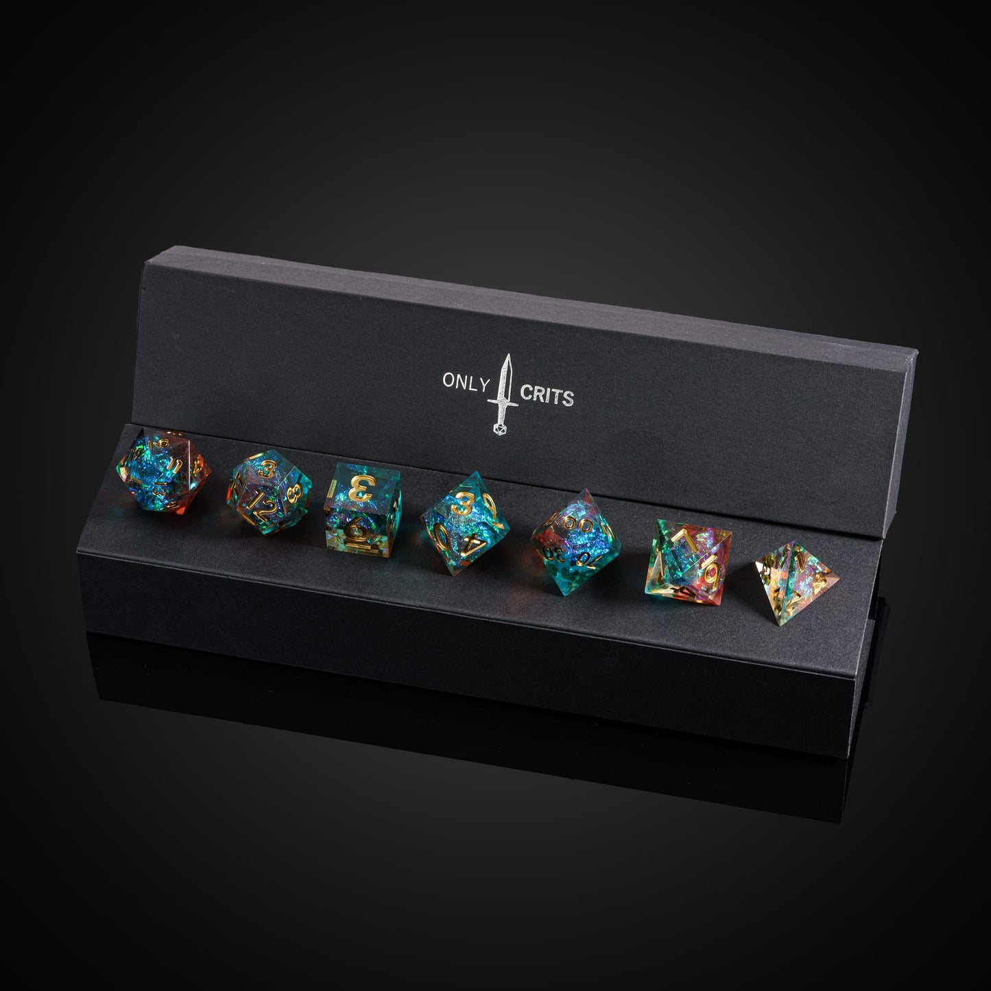 Starlight Nebula dice set in open Only Crits display case showing vibrant galaxy resin and gold numbering