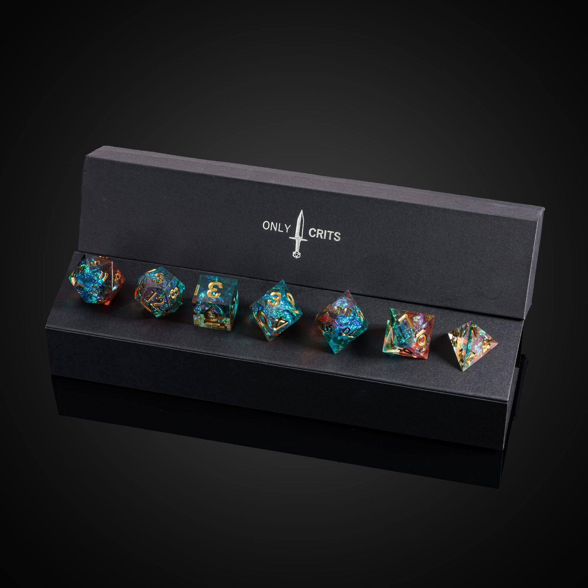 Starlight Nebula dice set in open Only Crits display case showing vibrant galaxy resin and gold numbering