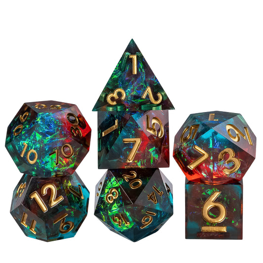 Starlight Nebula sharp edge dice set in teal and red resin with gold numbers stacked for display