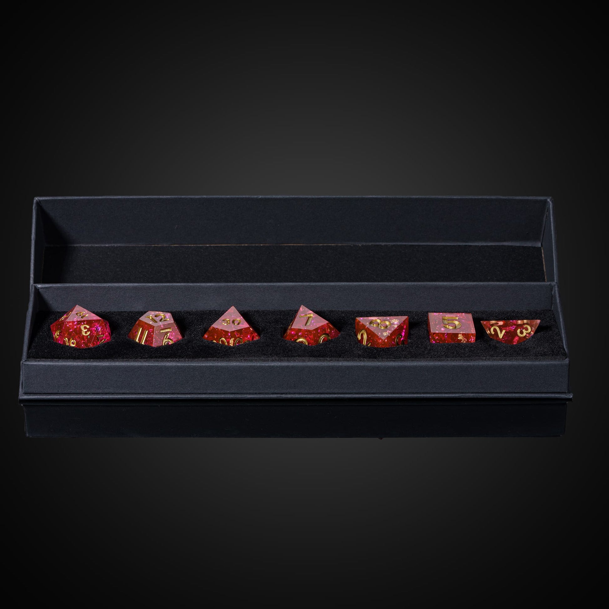 Starweaver's Legacy Sharp Edge Dice Set, 7 piece pink resin dice with gold numbering in foam case