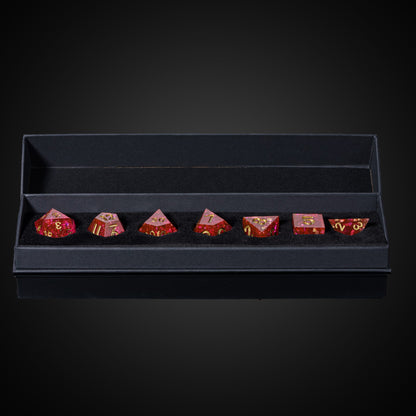 Starweaver's Legacy Sharp Edge Dice Set, 7 piece pink resin dice with gold numbering in foam case