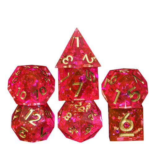 Starweaver's Legacy Sharp Edge Dice Set, stacked pink resin dice with gold numbering on white background