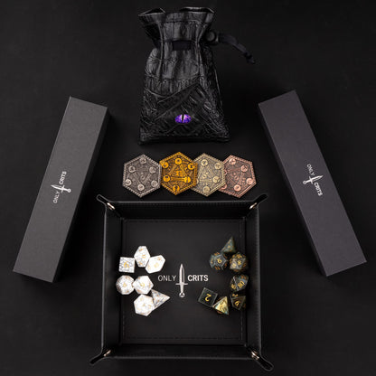 Collectible stone dice bundle with rolling tray, dice bag, and metal accessories on black background