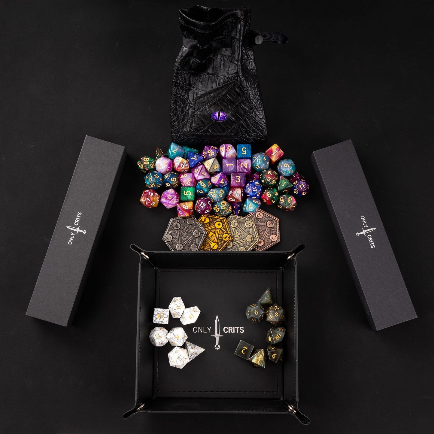 Premium stone dice sets displayed inside an Only Crits rolling tray with accessories and dice storage boxes
