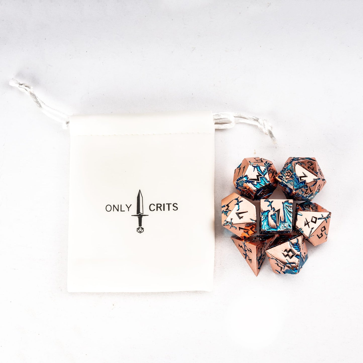 Stormwake Dragon metal dice set with Only Crits dice pouch for tabletop RPGs