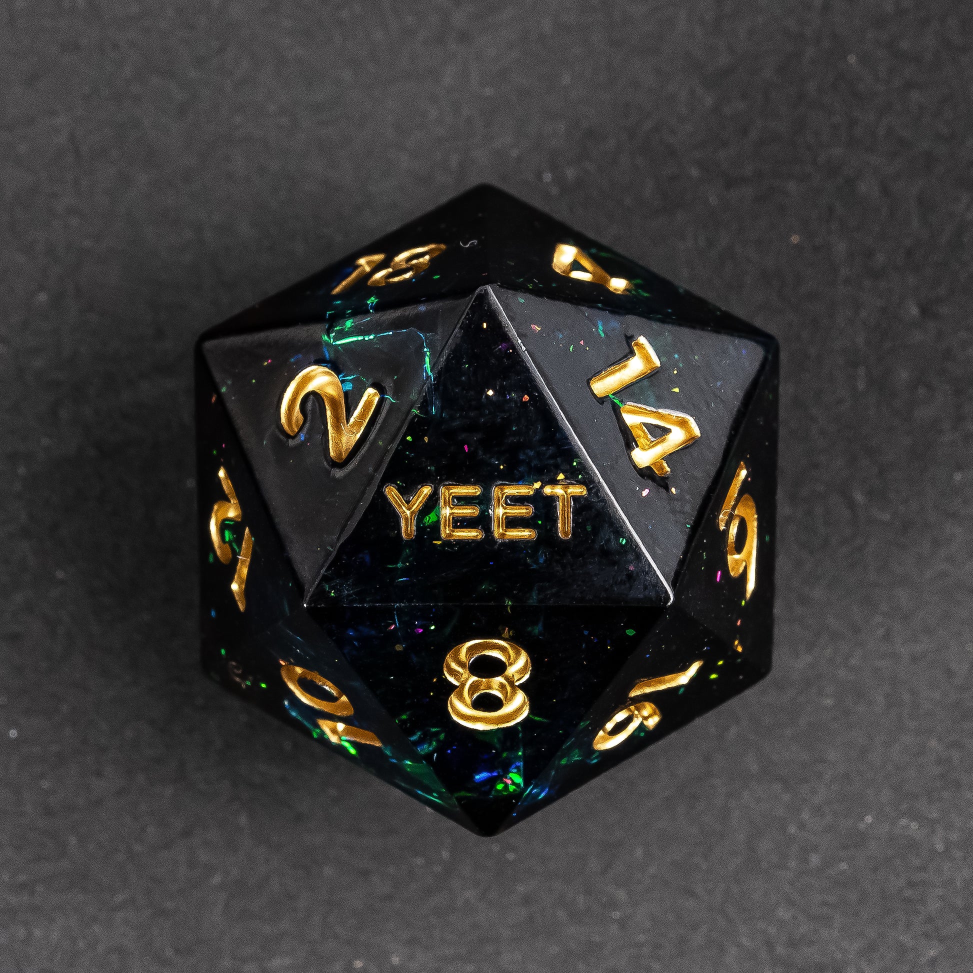 Close up of Supernova Remnant Yeet Sharp Edge D20 dice with galaxy-like shimmer for DnD & TTRPGs