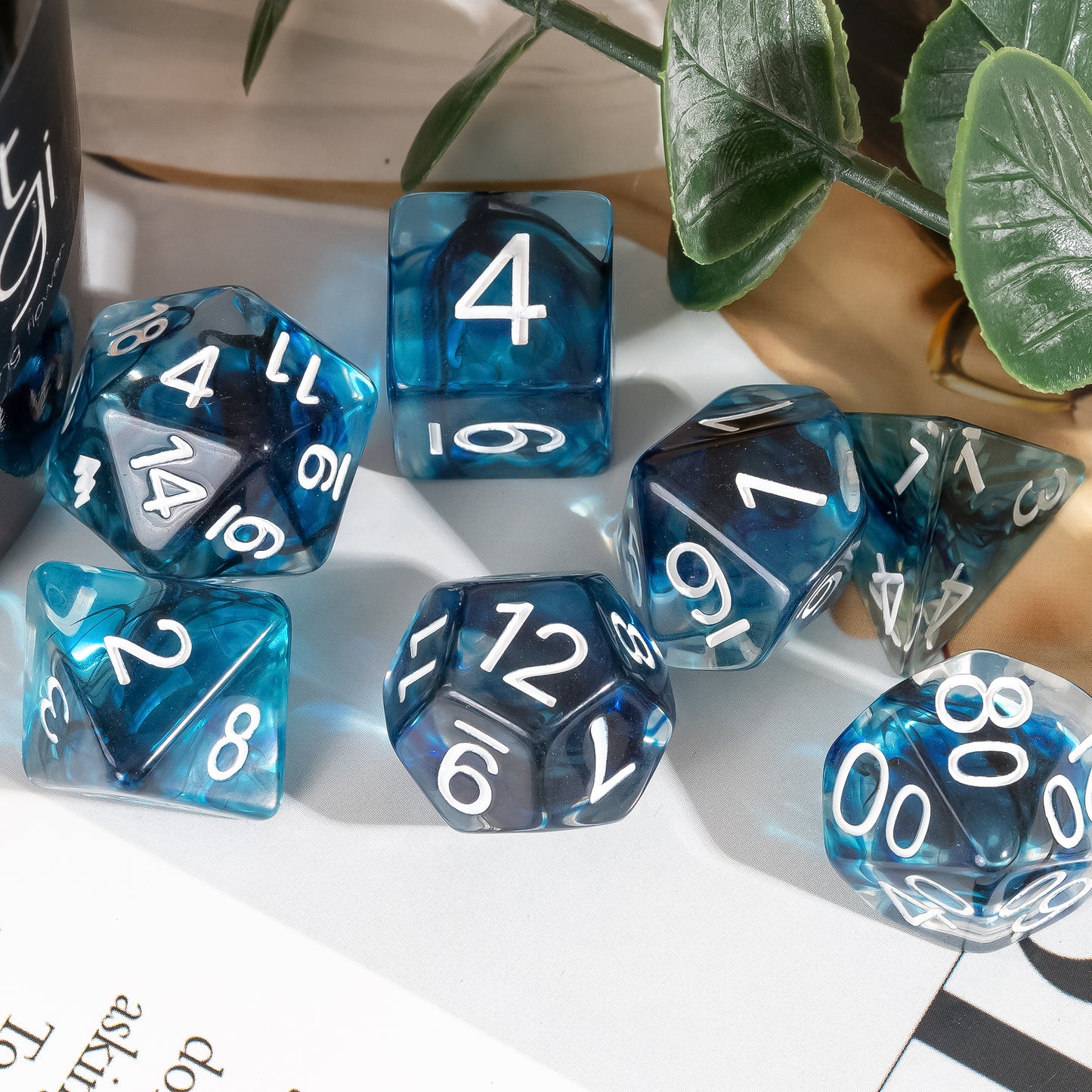 Thunderstrike Dice Set lifestyle display showcasing blue and gray resin dice with white numbering arranged on a tabletop