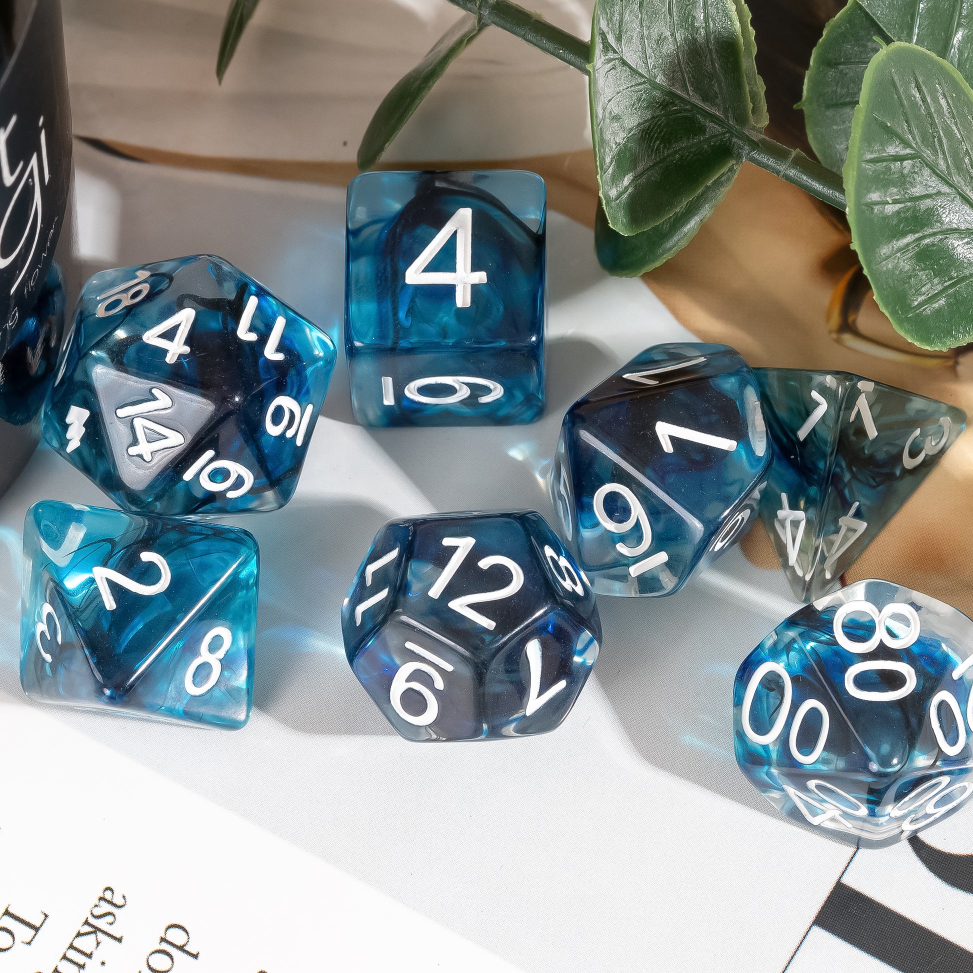 Thunderstrike Dice Set lifestyle display showcasing blue and gray resin dice with white numbering arranged on a tabletop