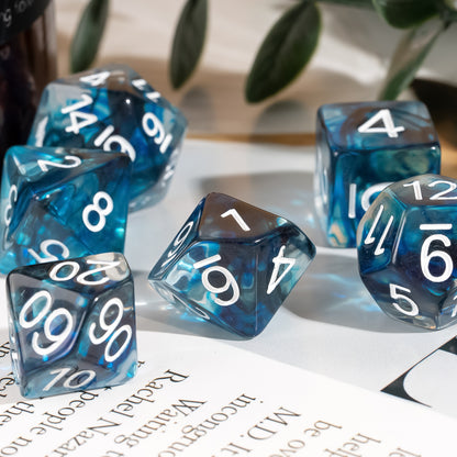 Thunderstrike Sharp Set close-up featuring multiple blue resin dice with white numbering arranged on an open book