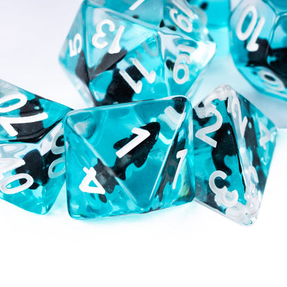 Close up of Transparent Black Shark Dice Set resin dice with white numbering for DnD