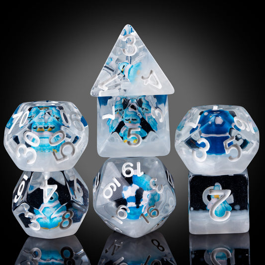 Transparent Blue Penguin dice set with frosted resin and blue penguin figurines inside