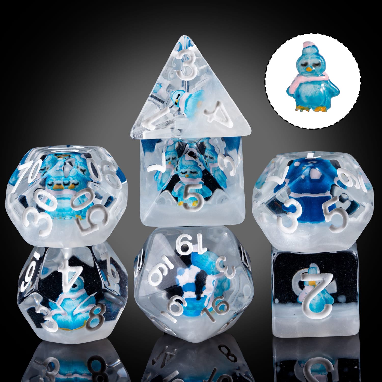Transparent Blue Penguin dice set with extra penguin figurine shown on side