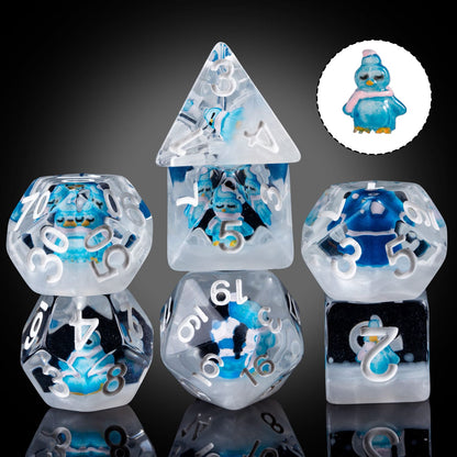Transparent Blue Penguin dice set with extra penguin figurine shown on side