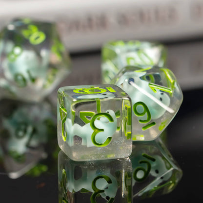 Close up of Transparent Dino D6 and D20 showing embedded dinosaur figures in clear resin
