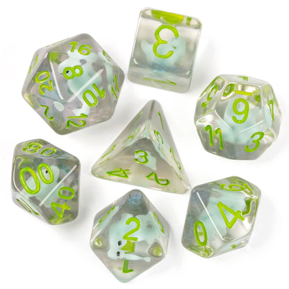 Top view of Transparent Dino Dice Set showing embedded dinosaur miniatures in clear green resin