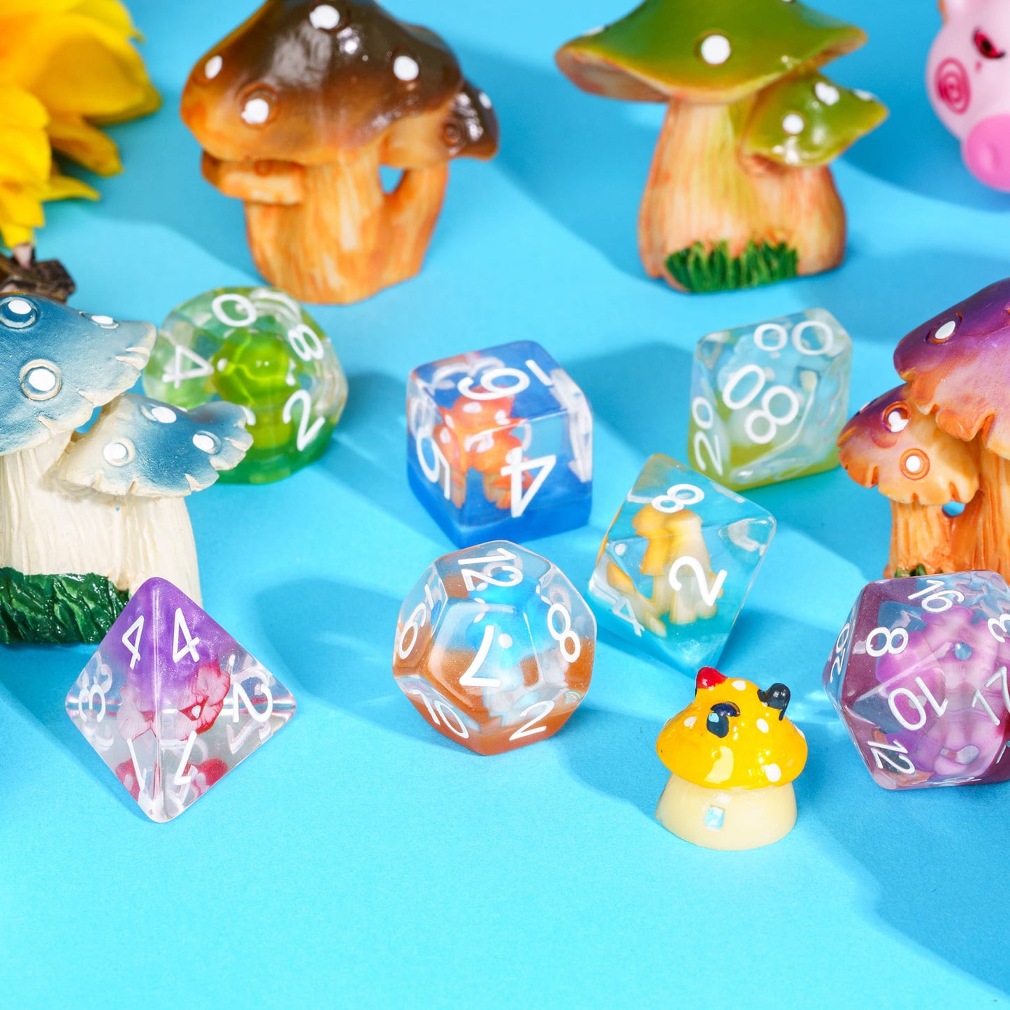 Transparent Feyshroom multicolor resin dice set, displayed with mushrooms for DnD & RPG