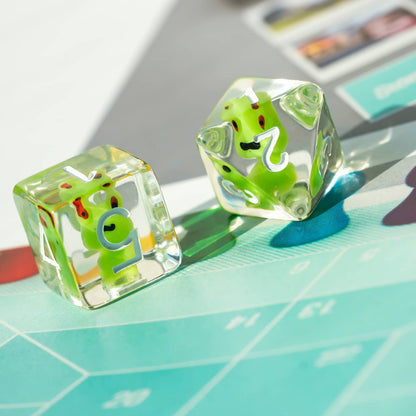 Pair of Transparent Froggo D6 dice highlighting green frog design and clear resin finish