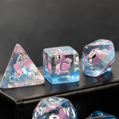 Close-up of Transparent Pink Squirrel D6 and D4 dice with clear resin and pastel tones