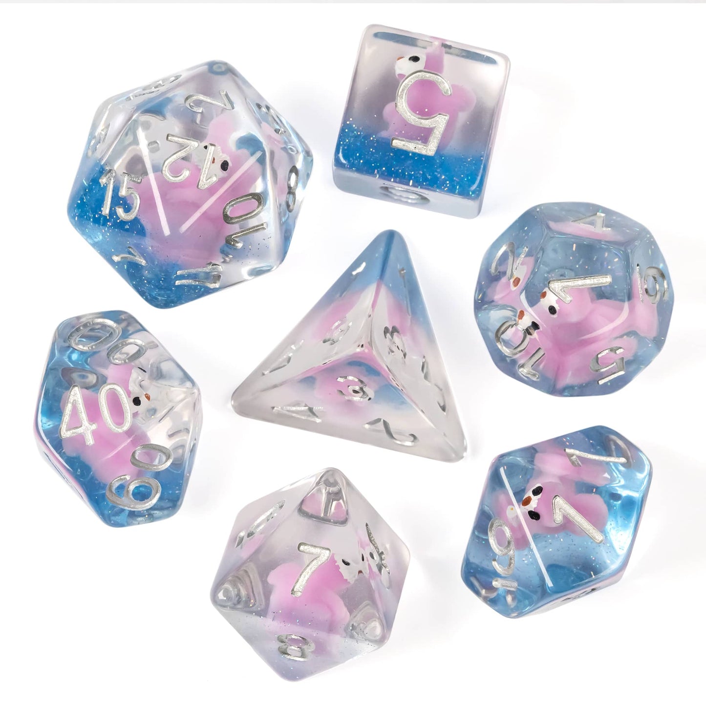 Flat lay of Transparent Pink Squirrel Dice Set showing seven dice with pink squirrel figures inside
