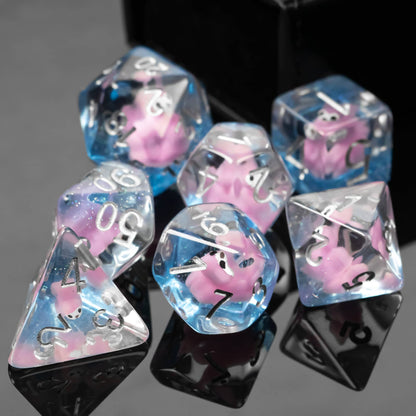 Front view of Transparent Pink Squirrel Dice Set with pastel blue and pink resin for DnD