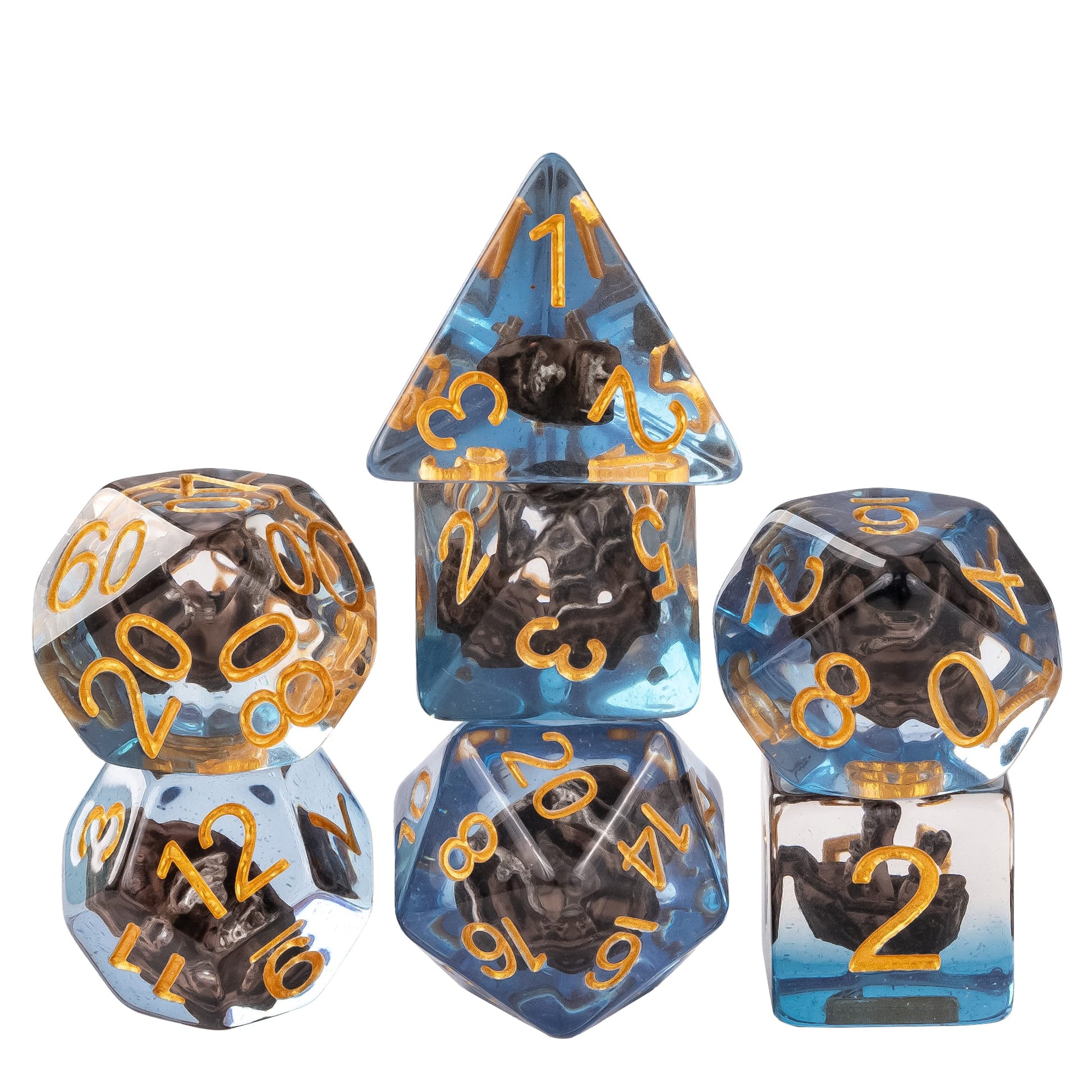 Transparent sail boat dice set with miniature black ship inclusions in blue resin and gold numbering