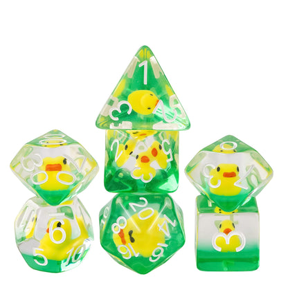 Transparent yellow ducky dice set with miniature duck inclusions in green resin and white numbering