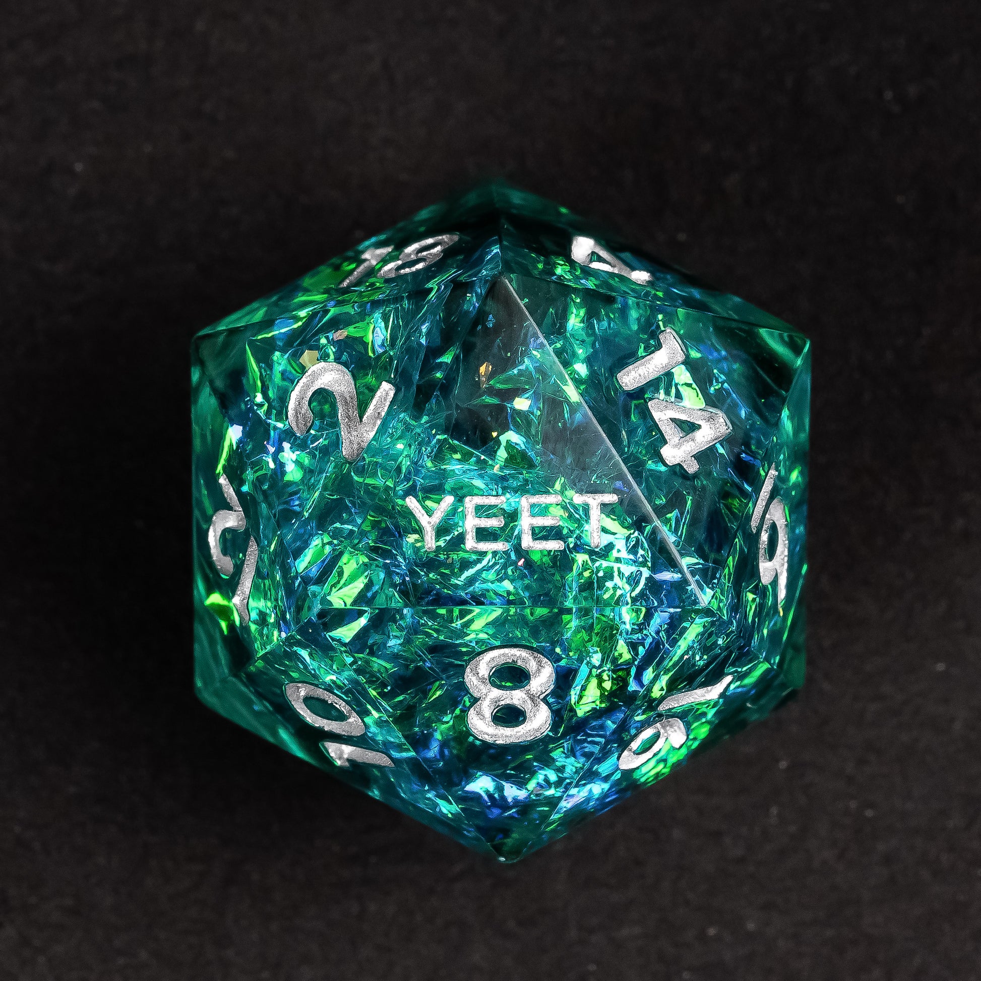 Display of Turquoise Soul Sharp Edge Yeet Dice Set with shimmering turquoise & silver tones