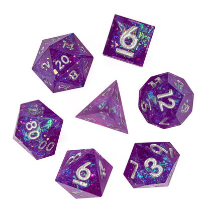 Flat lay of Violet Beam sharp dice set on white background with silver numbers
