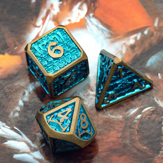 Blue metal dice with gold trim and numbers