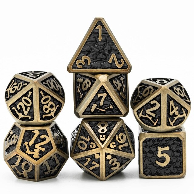 Black metal dice set with gold trim and numbers