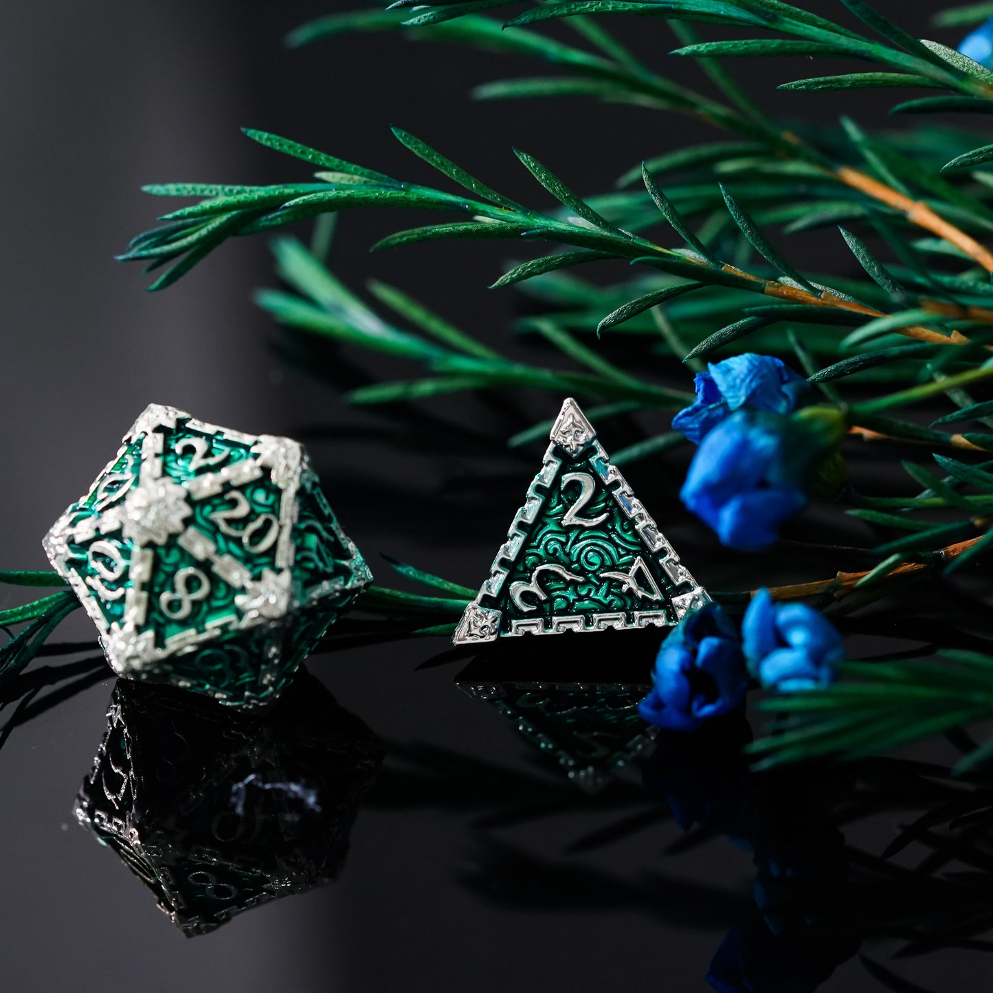 D20 and d4 with rosemary in background