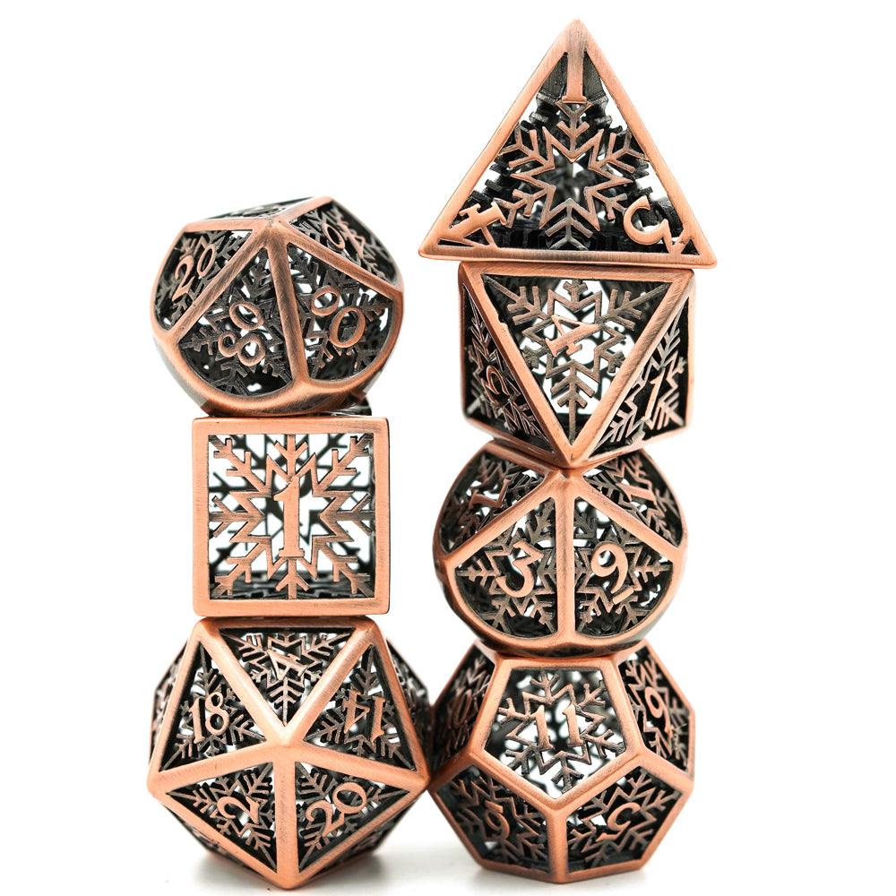 7 piece bronze dice set stacked on top of itself