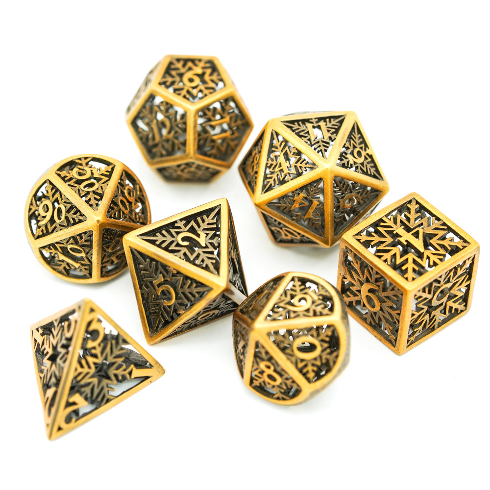 gold hollow metal dice with snowflake patterns
