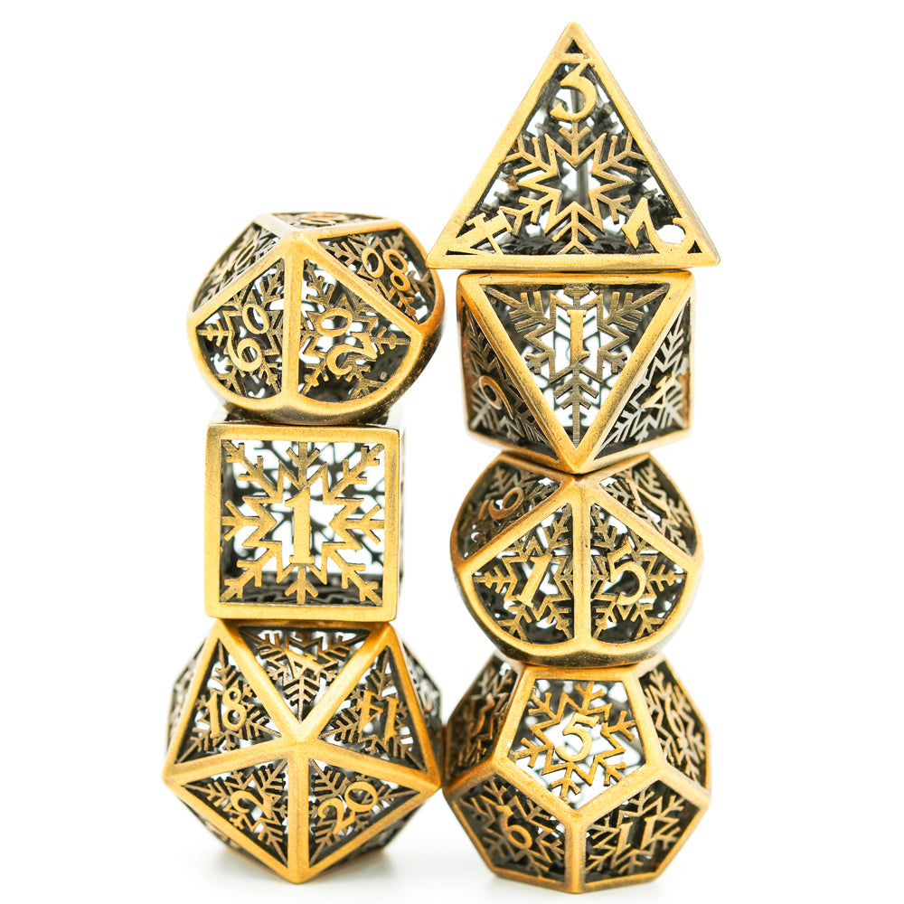 7 piece gold colored dice set stacked on top of itself