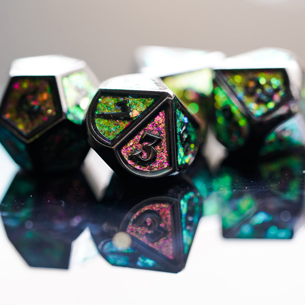 d10 highlight showing green and pink sparkles on metal dice